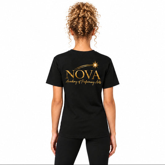 A woman viewed from the back wearing a black short-sleeve T-shirt with a gold 'NOVA Academy of Performing Arts' graphic printed on the back, paired with black leggings, against a neutral light gray background.