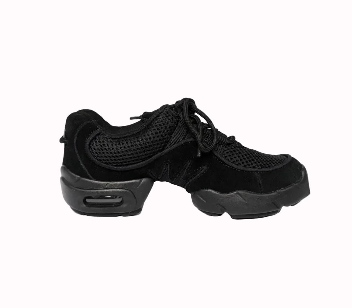 A black athletic sneaker with a mesh upper, black laces, and a chunky black sole with a visible air cushion unit, shown from a side profile on a white background.