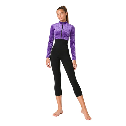 A woman modelling a one-piece jumpsuit with a CS Purple Crop Jacket crushed velvet long-sleeve top and a black high-waisted, form-fitting legging bottom, shown against a plain white background.