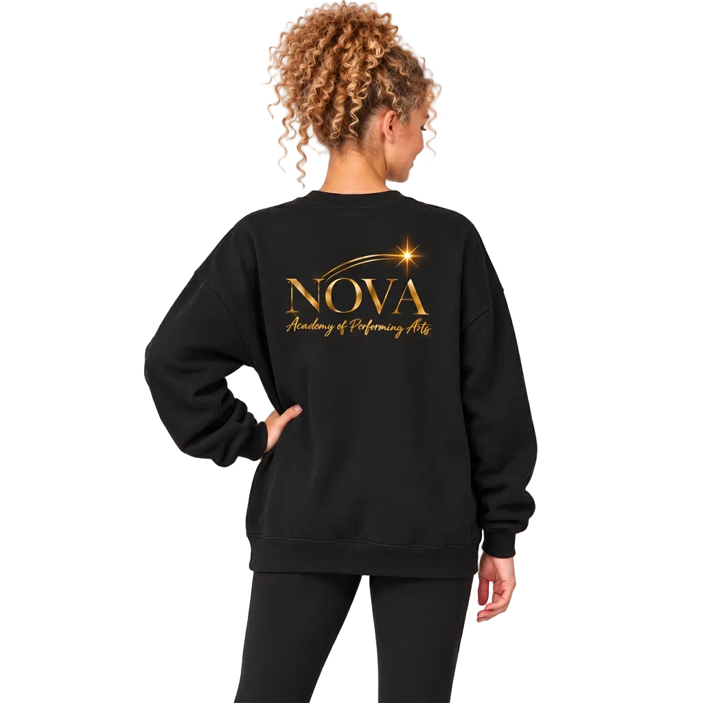 A woman shown from the back wearing a black crewneck sweatshirt with a gold 'NOVA Academy of Performing Arts' graphic on the back, paired with black leggings, against a solid gray studio background.